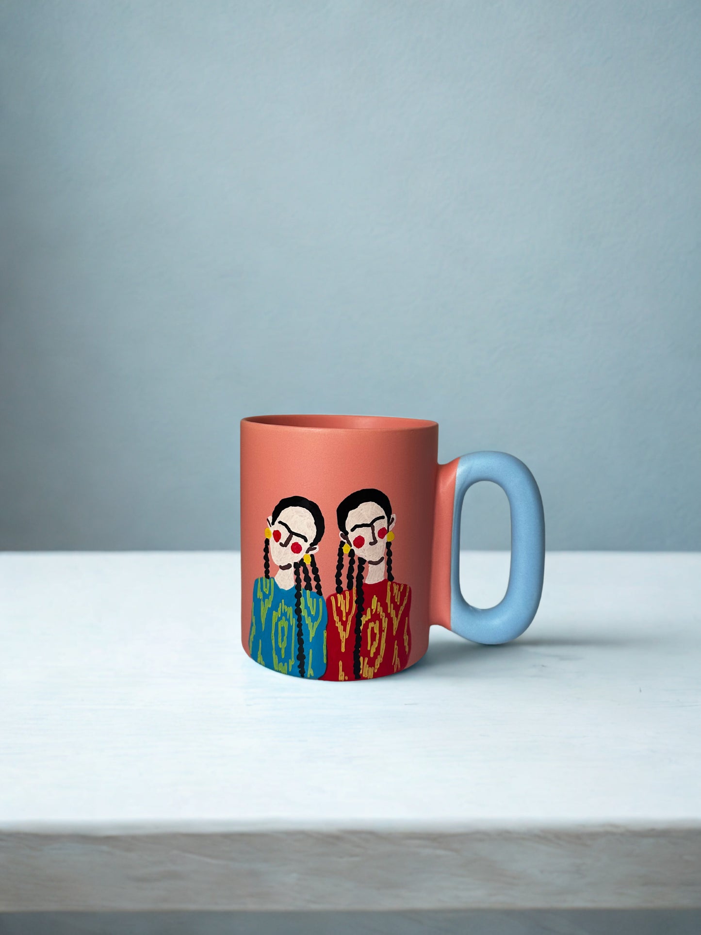 2 Uyghurs on pastel pink mug