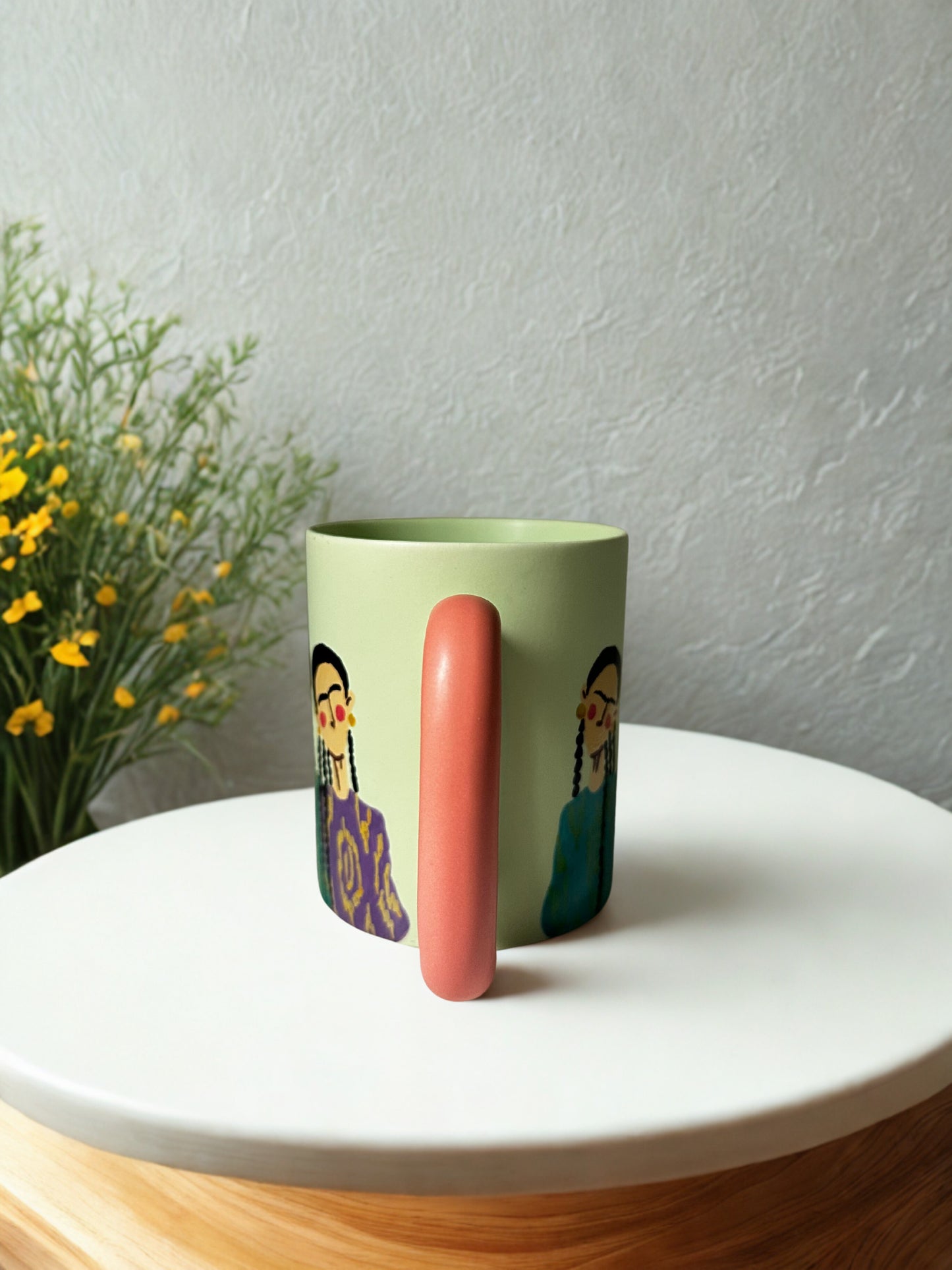 3 Uyghur girls on pastel green mug